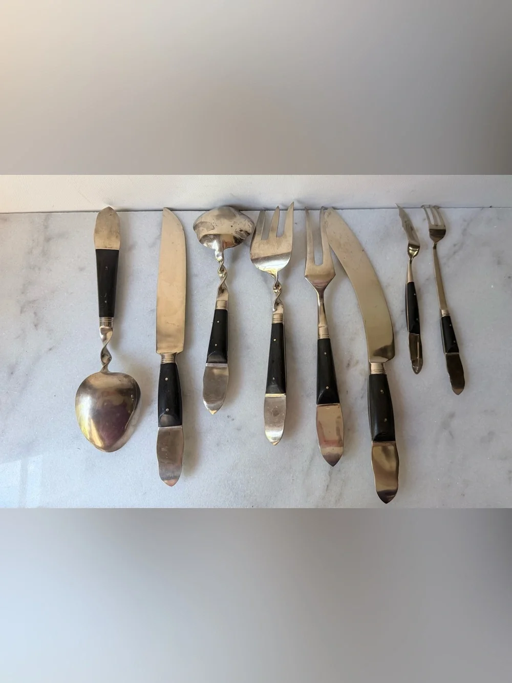 set consists of vintage Thai brass or bronze utensils with dark wooden handles.